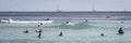 Honolulu, Hawaii - Nov 6, 2021-Young boys play on their boogey boards in the surf Royalty Free Stock Photo