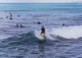 Honolulu, Hawaii - Nov 6, 2021-Young boys play on their boogey boards in the surf Royalty Free Stock Photo