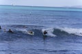 Honolulu, Hawaii - Nov 6, 2021-Young boys play on their boogey boards in the surf Royalty Free Stock Photo