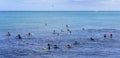 Honolulu, Hawaii - Nov 6, 2021-Young people wait with their boogey boards for the next surf wave Royalty Free Stock Photo