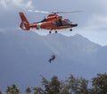 Honolulu, Hawaii, USA, 2022-08-14: Military Air Show, Coast Guard rescue helicopter in flgiht Royalty Free Stock Photo