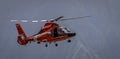 Honolulu, Hawaii, USA, 2022-08-14: Military Air Show, Coast Guard rescue helicopter in flgiht Royalty Free Stock Photo