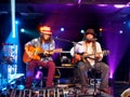 Tavana and Keith Batlin play guitar and sing on stage at Crossroads