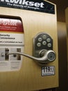 Kwikset Electronic Lock Lever on display inside Lowes Store