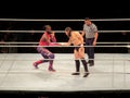 Wrestler Kofi Kingston shake hands with Daniel Bryan stands in the ring