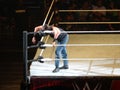 WWE Wrestler Luke Harper rest head on corner turnbuckle during match in WWE ring