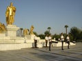 Soldiers march at golden statue in Turkmenistan Royalty Free Stock Photo