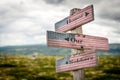 Honor our soldiers text on wooden american flag signpost outdoors Royalty Free Stock Photo