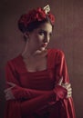 Honor and pride. Female portrait with medieval dress and crown Royalty Free Stock Photo