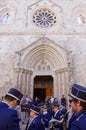 Larino - Molise - In the foreground the musical band accompanying the procession, in the background the Cathedral of San Pardo.