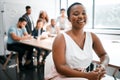 Honored to have a seat at the table. Cropped portrait of an attractive young businesswoman attending a meeting in the Royalty Free Stock Photo