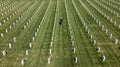 Honoring the Fallen: A Marine\'s Tribute at National Military Cemetery Royalty Free Stock Photo