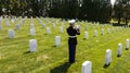 Honoring the Fallen: A Marine\'s Tribute at National Military Cemetery Royalty Free Stock Photo