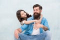 Honoring fathers and celebrating fatherhood. Little daughter hugging father on fathers day. Bearded man and small child