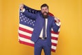 Honour and glory to my country. Happy businessman holding old glory american flag on yellow background. Bearded man in Royalty Free Stock Photo