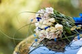 The hood of a black car is decorated with a bouquet of flowers in a wedding style. Royalty Free Stock Photo