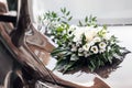 The hood of a black car is decorated with a bouquet of flowers in a wedding style. Royalty Free Stock Photo