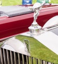 The hood ornament on an old Rolls Royce
