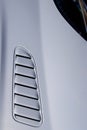 The hood of a powerful white sports car. closeup of a Jaguar F-type hood SVR