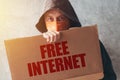 Hooded activist protestor holding Free Internet protest sign Royalty Free Stock Photo