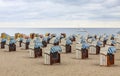 Hooded beach chairs strandkorb at Baltic seacoast in Travemunde, Germany Royalty Free Stock Photo