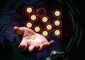 Hooded cyber crime hacker using mobile phone hacking blockchain