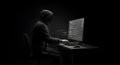 Hooded Hacker Coding in the Dark Royalty Free Stock Photo