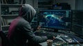 Hooded hacker developing global cyberattack on multiple computer screens Royalty Free Stock Photo