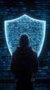 Hooded hacker figure standing by digital security shield Royalty Free Stock Photo