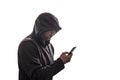 Hooded hacker holding smartphone