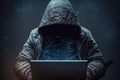 Hooded hacker sitting in front of a laptop with dark background. Generative AI Royalty Free Stock Photo