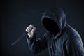 Hooded man with knife Royalty Free Stock Photo