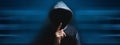 Hooded man making silence gesture Royalty Free Stock Photo