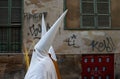 Hooded penitent waiting for the start of an easter holy week procession in mallorca detail on hoods detail