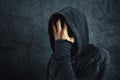 Hooded person fighting addiction crisis