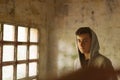 Hooded teenage boy in an abandoned house Royalty Free Stock Photo