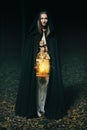 Hooded woman with lantern