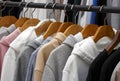 Hoodies on hangers in a clothing store, close-up