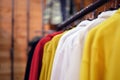 Hoodies on hangers in a clothing store, close-up, selective focus, colorful Royalty Free Stock Photo