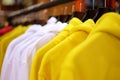 Hoodies on hangers in a clothing store, close-up, selective focus, colorful Royalty Free Stock Photo