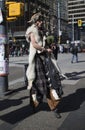 Hoofed bagpipe player in downtown Vancouver - front