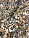 Hook, chain and pebbles