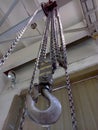 Hook and chains of mechanical old crane Royalty Free Stock Photo