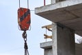 Hook of a construction crane near a house under construction Royalty Free Stock Photo