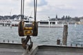 Hook of the crane on wire ropes in marina harbor of city of Lucerne situated on Lake Lucerne.