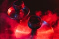 hookah bowl, shisha and coals close-up on a smoky black background with colored lighting Royalty Free Stock Photo