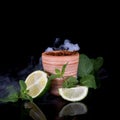 Hookah bowl with tobacco on an black background