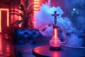 hookah shisha in smoke on table in cafe bar with neon light close-up on multicolored background