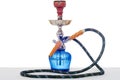 Hookah at white background. Smoking device on table in light int