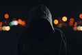 Hooligan with hoodie and obscured face at night Royalty Free Stock Photo